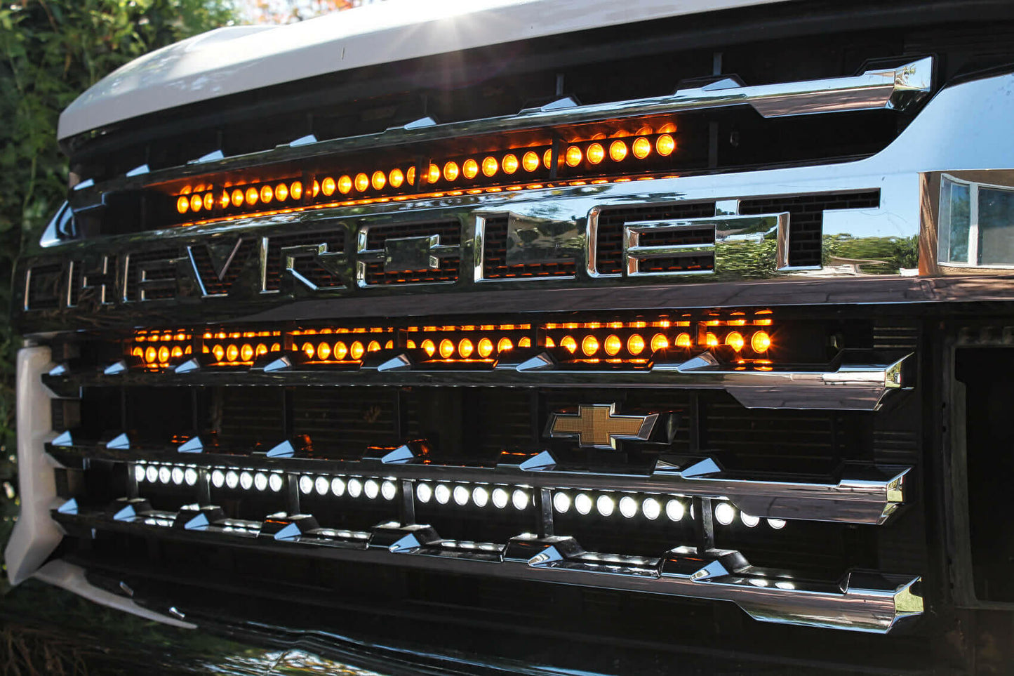 Close-up of a Chevrolet truck grille with LED lights