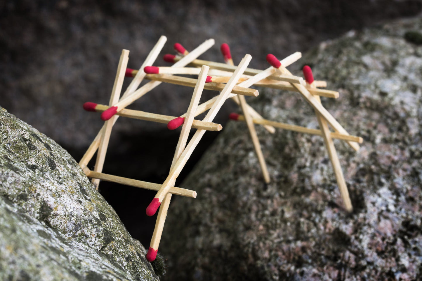 Matches arranged in a star shape on a textured stone surface