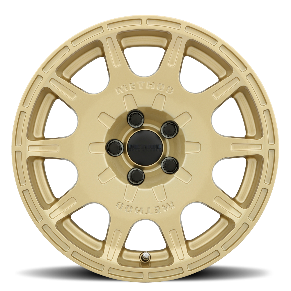 Gold alloy wheel on a white background