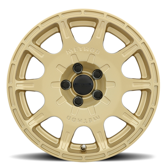 Gold alloy wheel on a white background