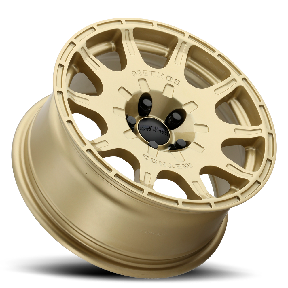 Gold alloy wheel on a white background