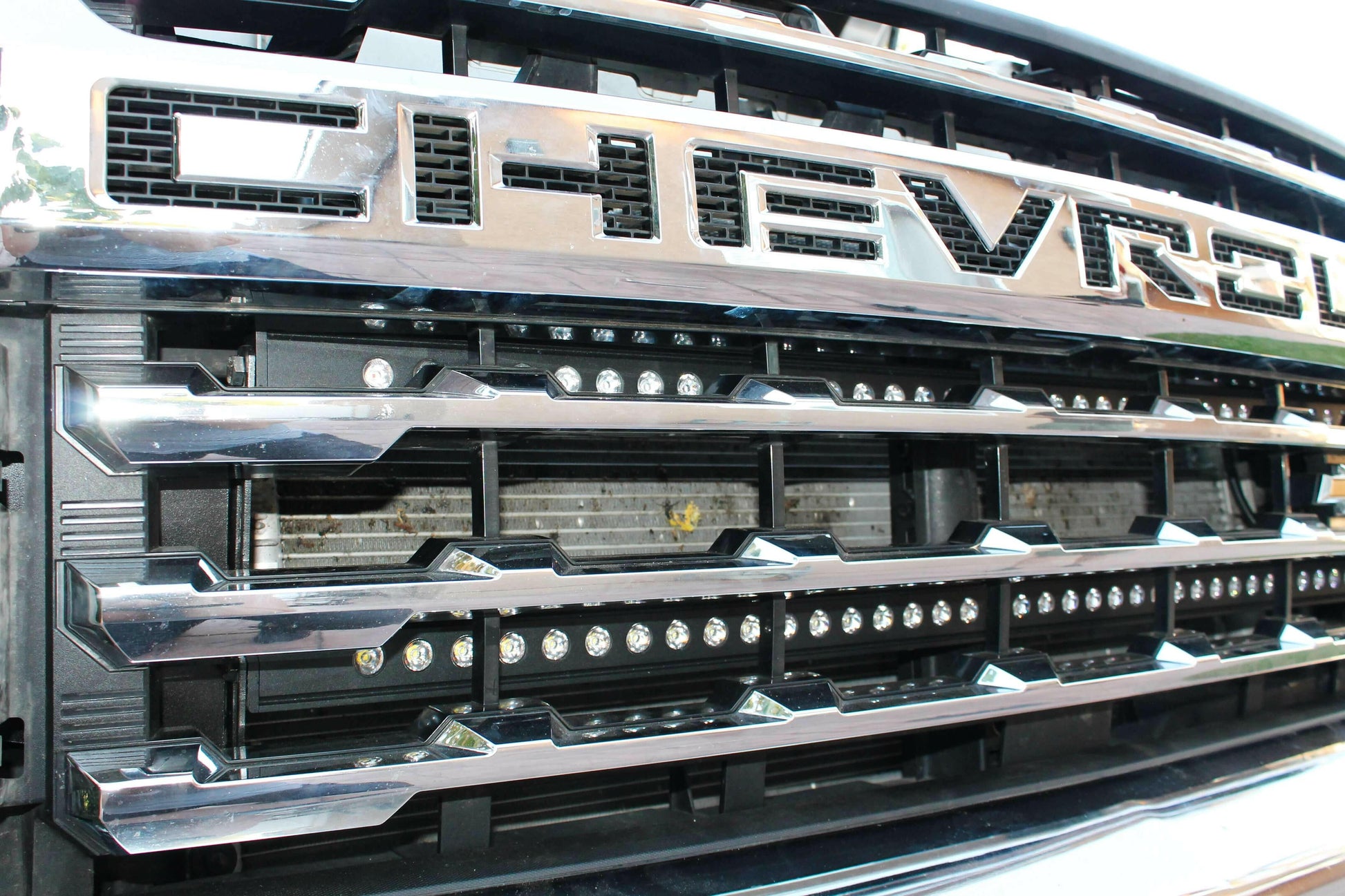 Close-up of a Chevrolet vehicle grille with prominent brand logo.