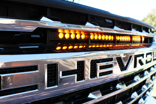 Close-up of a Chevrolet vehicle grille with LED lights