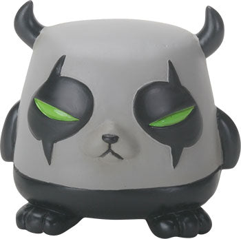 Gray creature figurine with black horns and green eyes on a white background