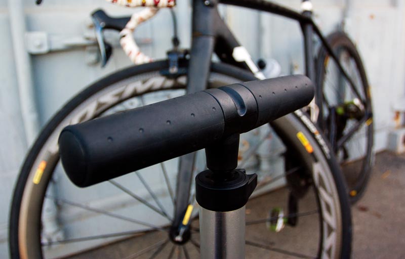 Close-up of a bicycle handlebar with a blurred background