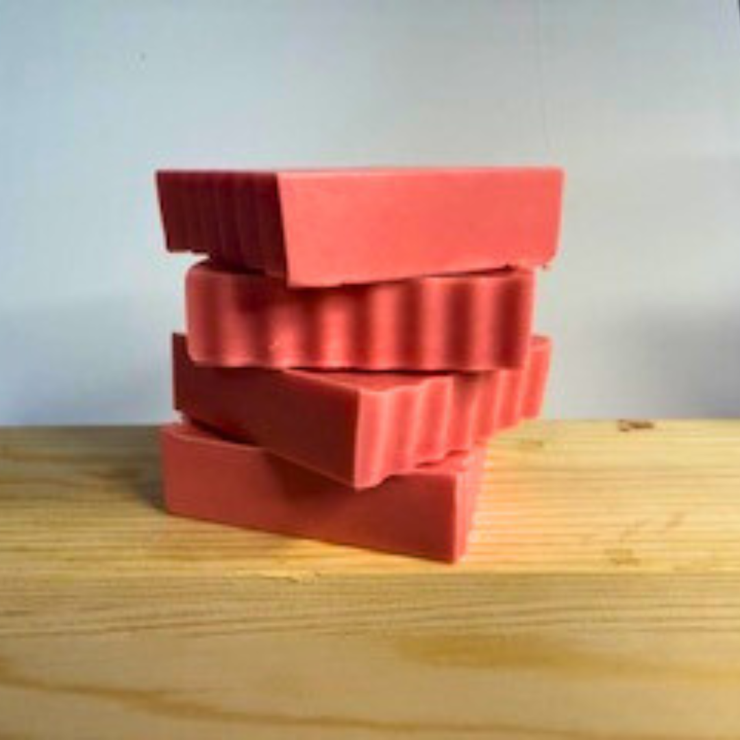 Grapefruit Splash- Grapefruit Scented Handmade Soap on a wooden surface with a light gray background