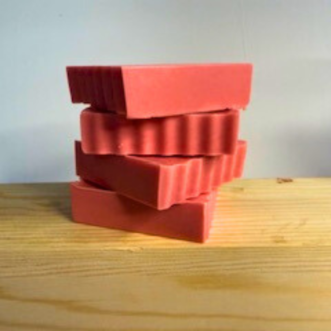 Grapefruit Splash- Grapefruit Scented Handmade Soap blocks on a wooden surface with a light gray background
