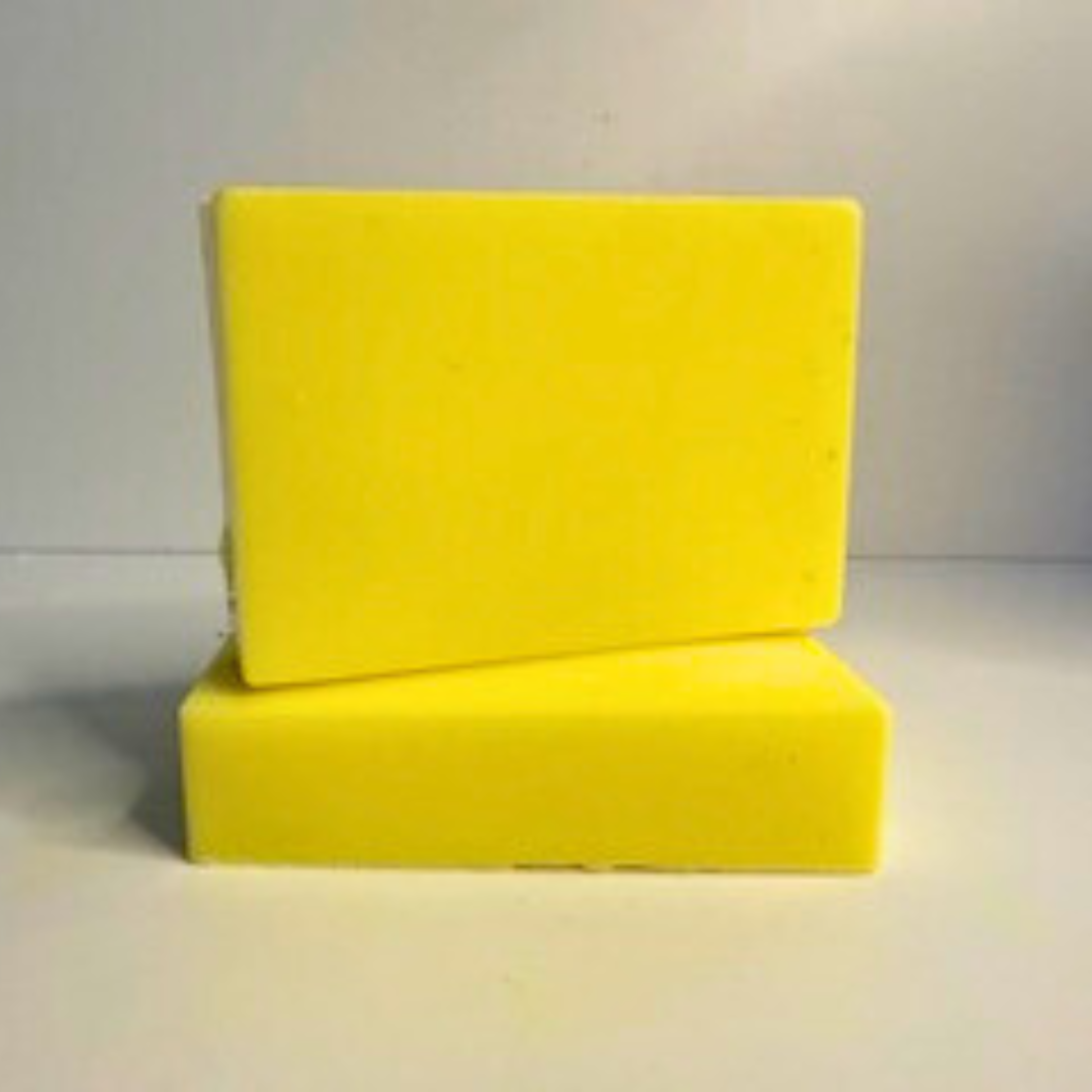 Two Lemon Zest- Lemon Scented Handmade Soap blocks on a light gray background