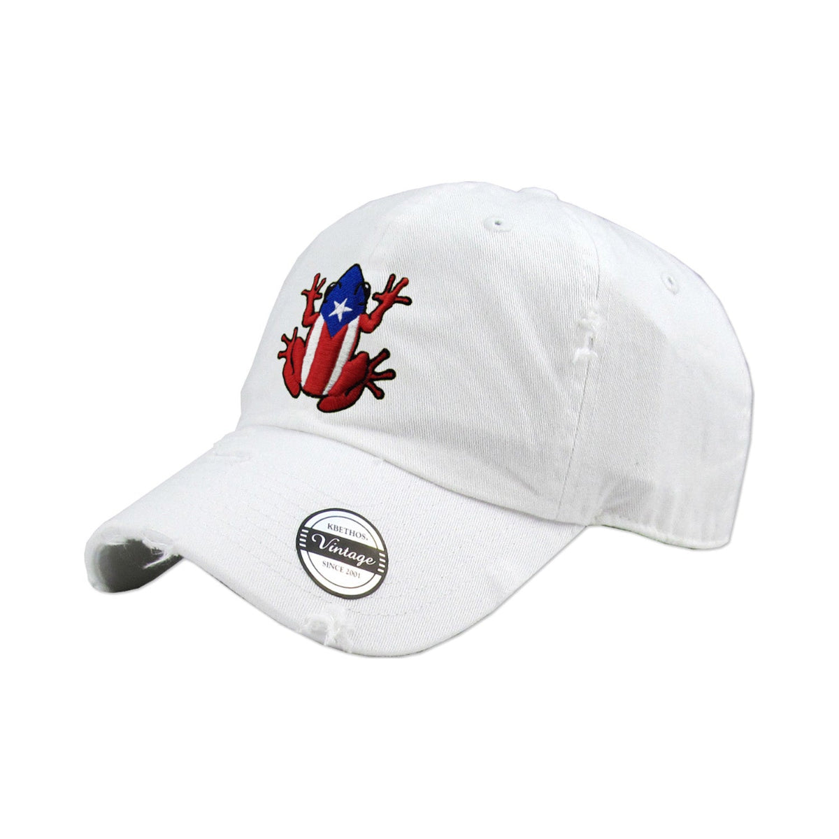 White cap with a red and blue coqui frog design on a white background