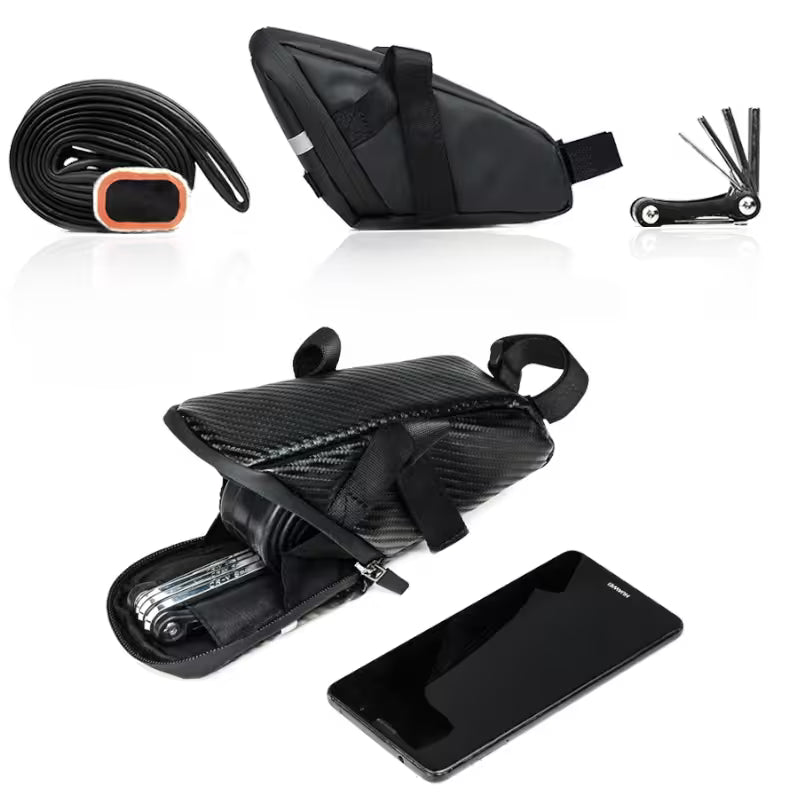 Black bike saddle bag with tools and phone on a white background