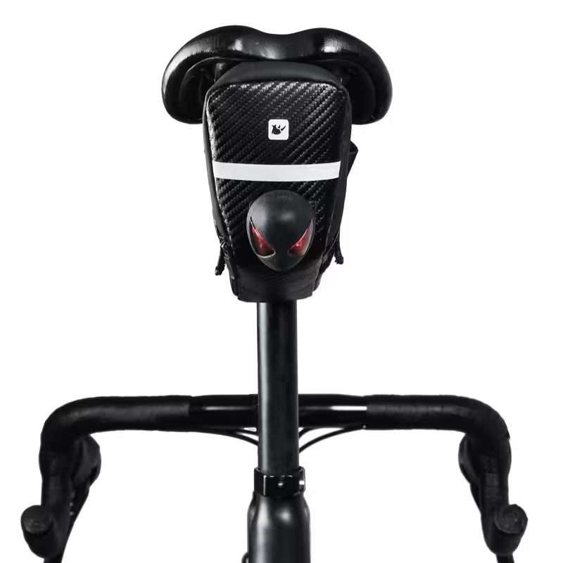 Black scooter seat with red accents on a white background