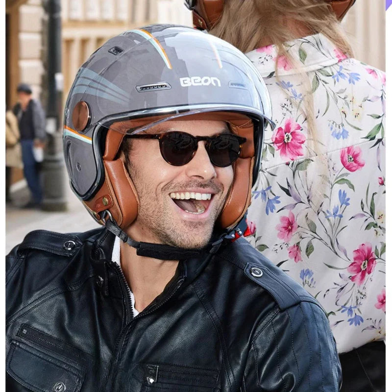 Man wearing a helmet and sunglasses with a blurred background