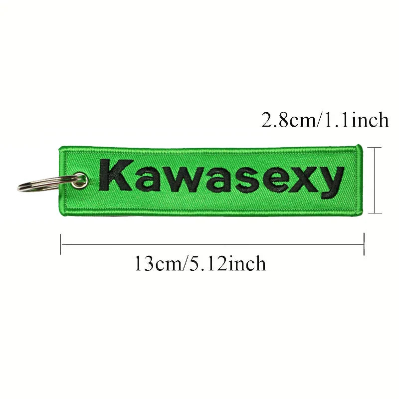 Green keychain with 'Kawasexy' text and measurements on a white background
