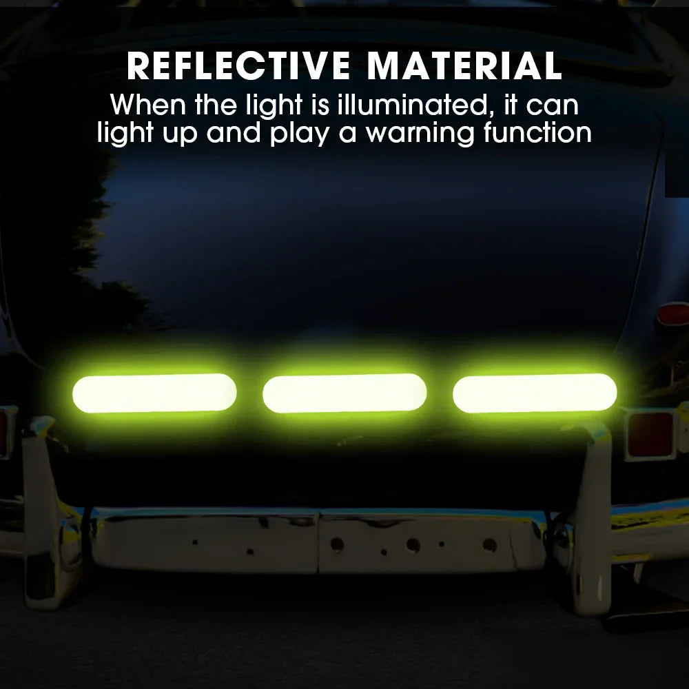 Reflective material on a vehicle's bumper with illuminated lights in a dark setting.