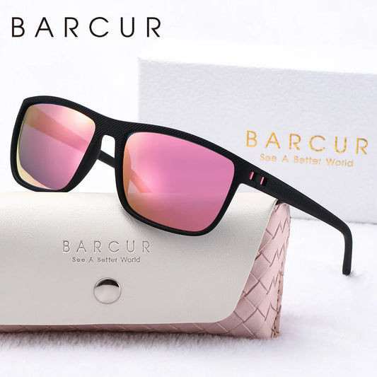 Sunglasses with pink lenses and black frame on a white background with BARCUR branding.