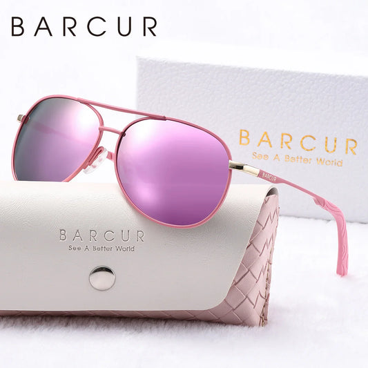 Pink sunglasses with BARCUR branding on a white background