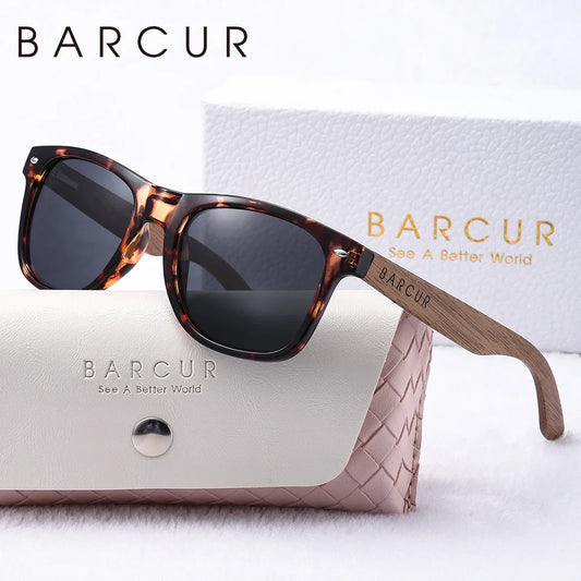 Sunglasses with tortoiseshell frame and wooden arm on a white background, featuring the BARCUR brand.
