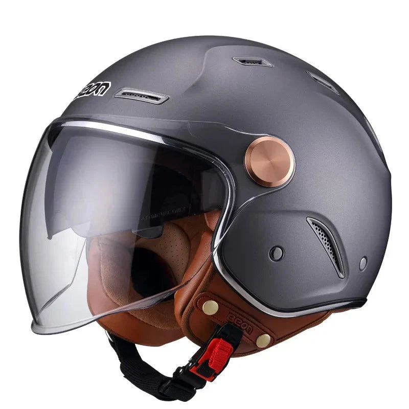 Gray motorcycle helmet with brown leather chin guard on a white background