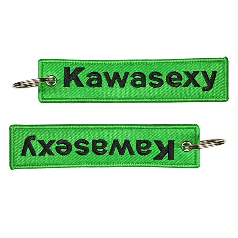Two green keychains with 'Kawasexy' text on a white background