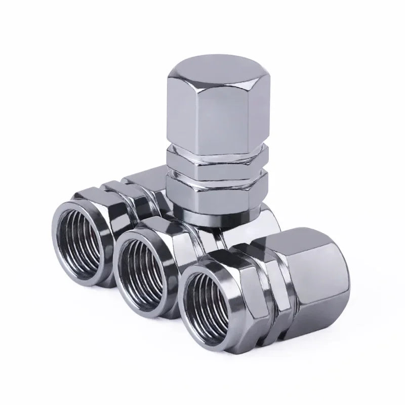 Chrome valve stem caps on a white background
