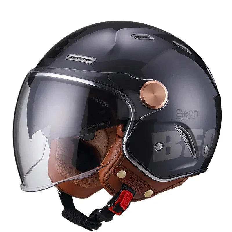 Black and brown motorcycle helmet with clear visor on a white background