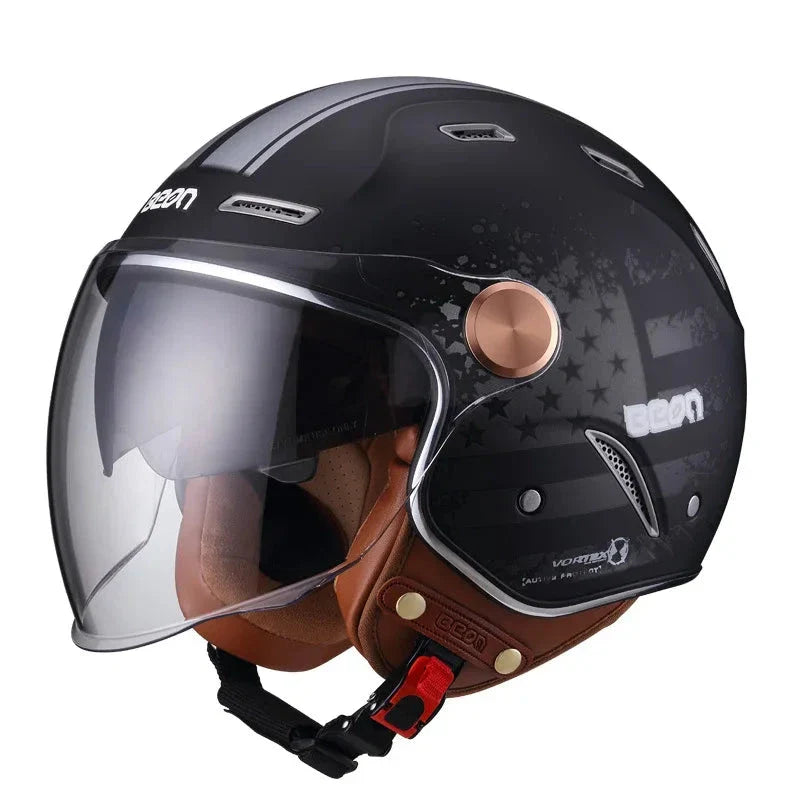 Black motorcycle helmet with visor and brown leather chin guard on a white background