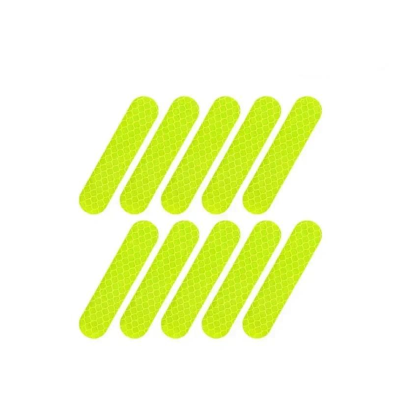Set of ten green reflective strips on a white background