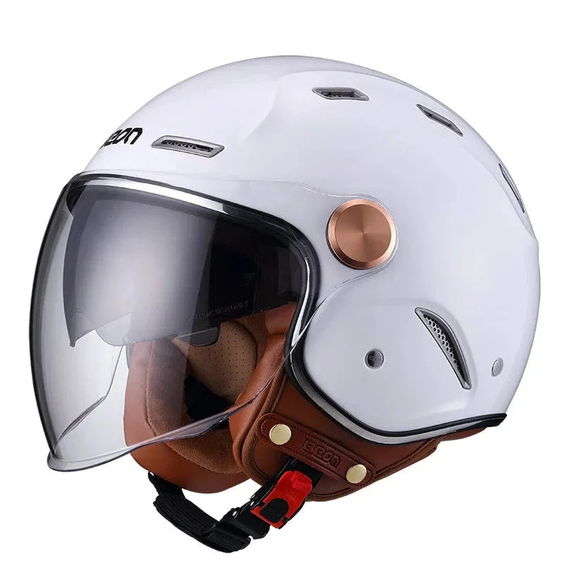 White motorcycle helmet with brown interior and clear visor on a white background