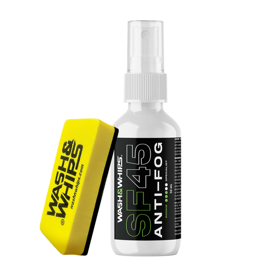Anti-fog spray bottle and yellow sponge with 'Wash N' Wipes' branding on a white background