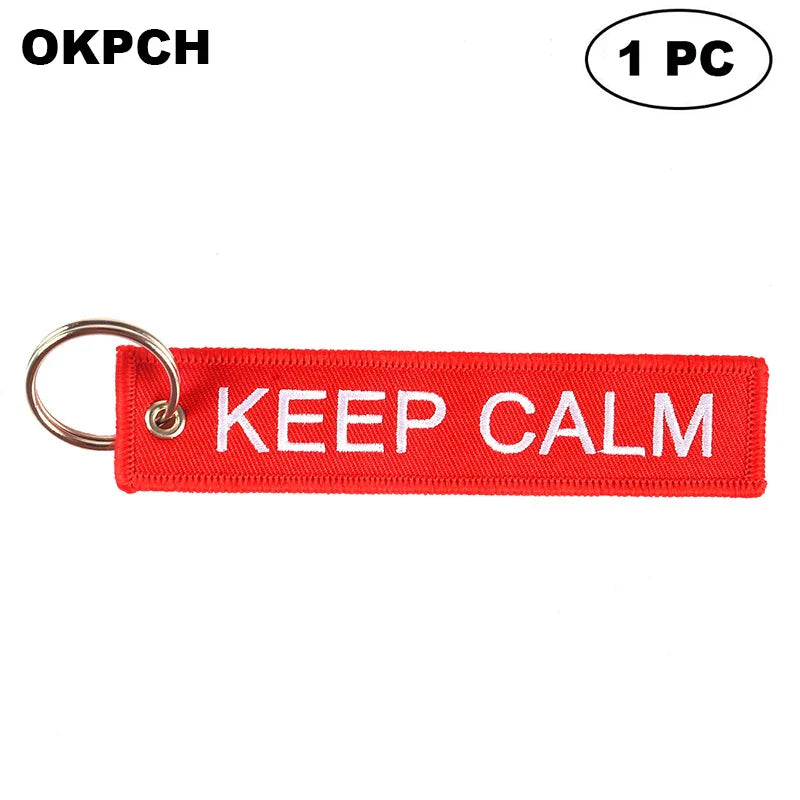 Red keychain with 'KEEP CALM' text on a white background