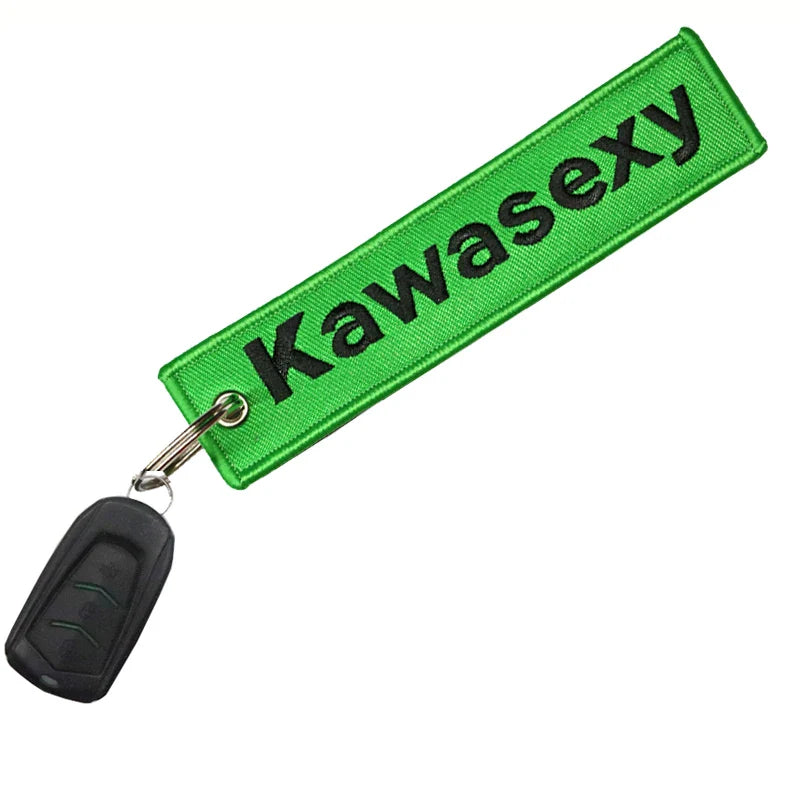 Green keychain with 'Kawasexy' text on a white background