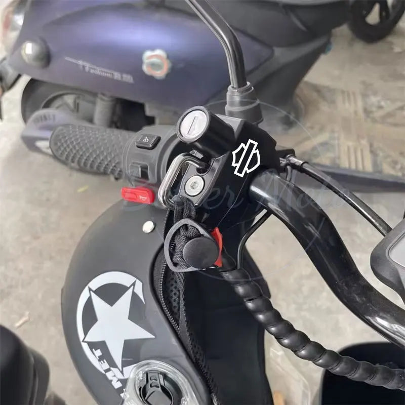 Close-up of a motorcycle handlebar with control buttons and throttle grip.
