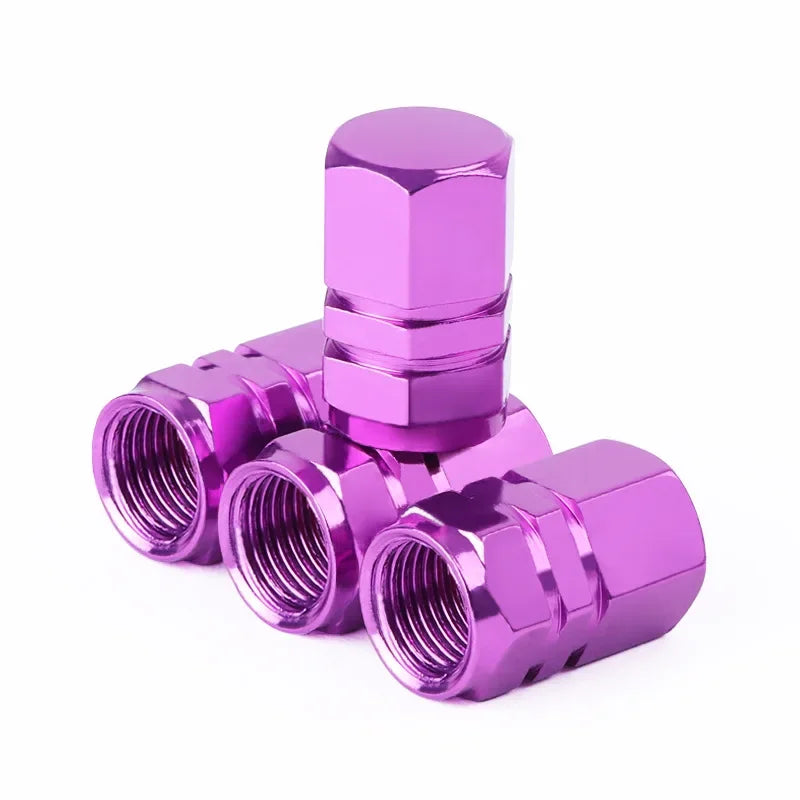 Purple metal valve stem cap on a white background