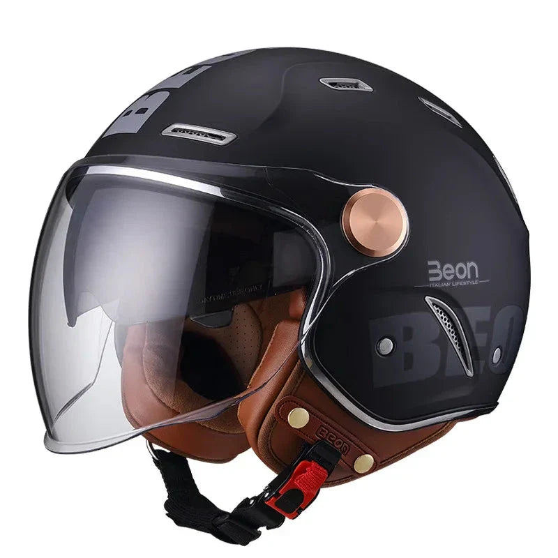 Black and brown motorcycle helmet with clear visor on a white background