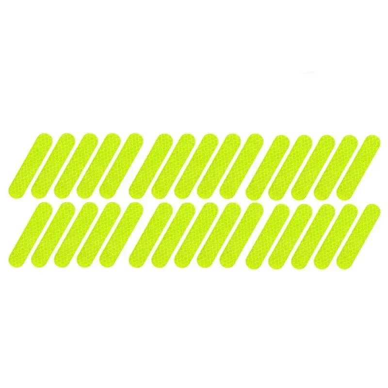 Set of green reflective stickers on a white background