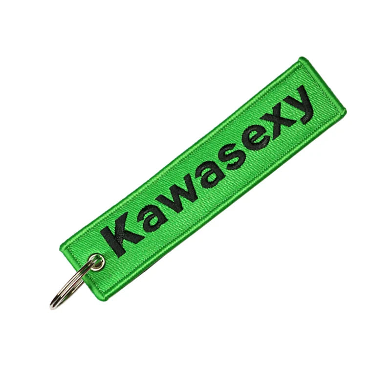 Green keychain with 'Kawasexy' text on a white background