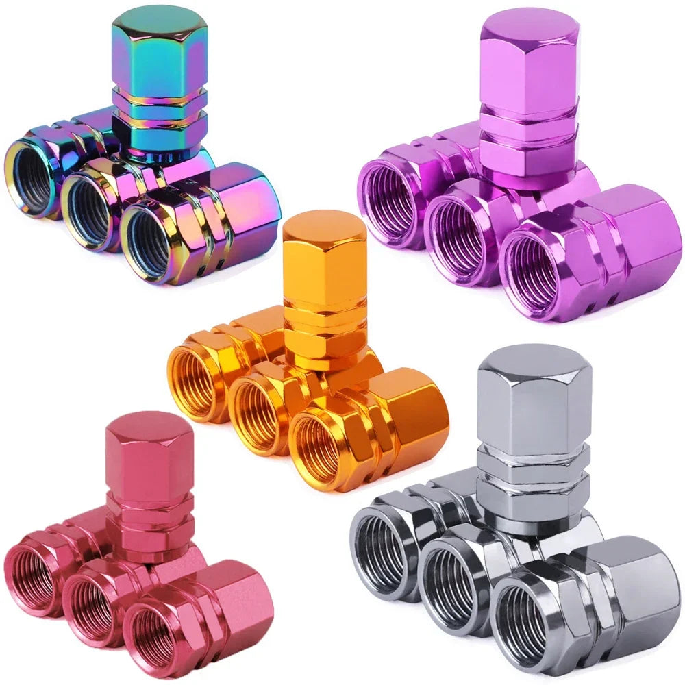 Set of colorful metal valve stem caps on a white background