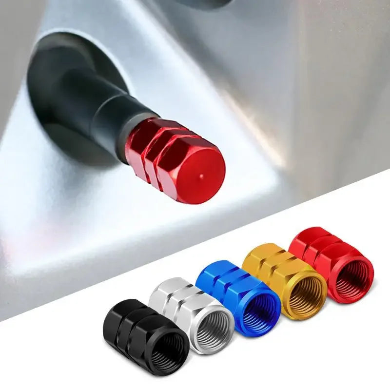 Set of colorful metal valve stem caps on a white background
