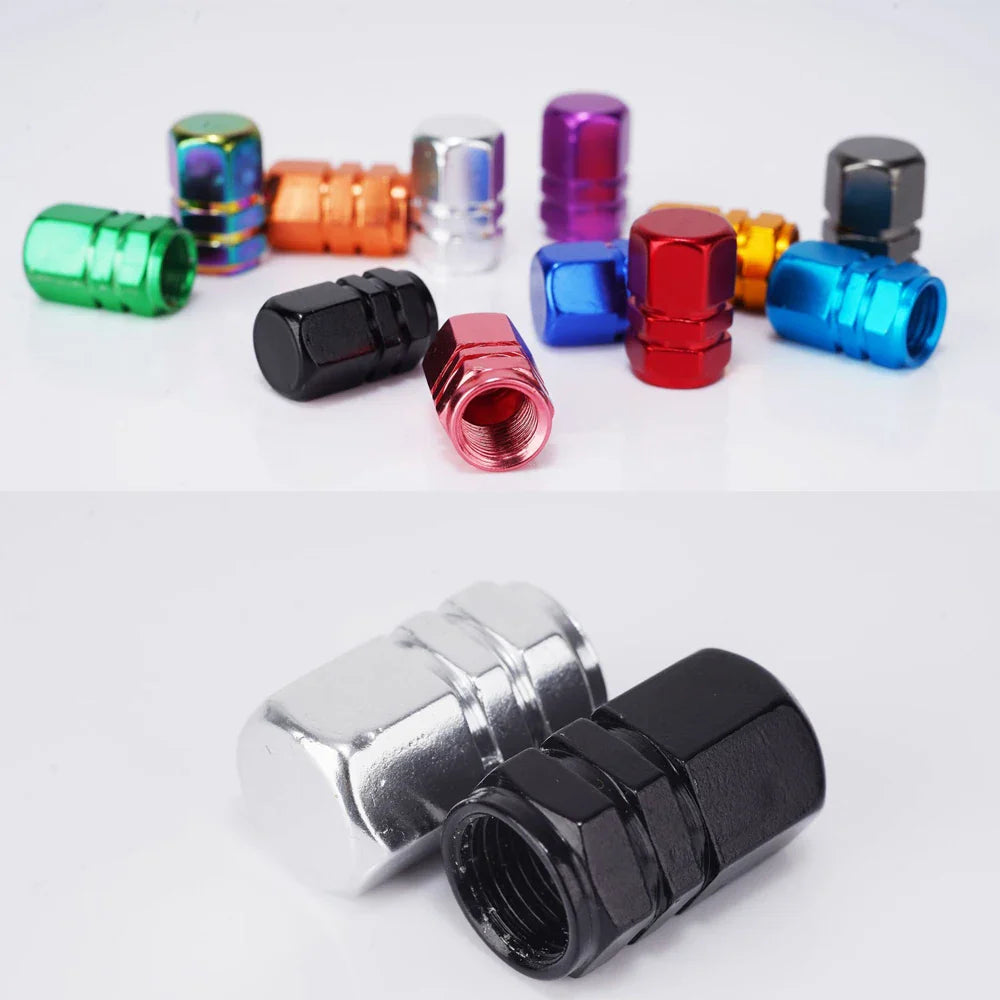 Colorful metal valve stem caps on a white background