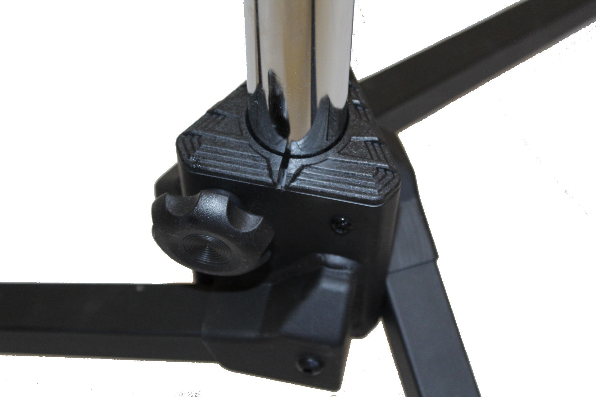 Close-up of a black metal stand with a white background