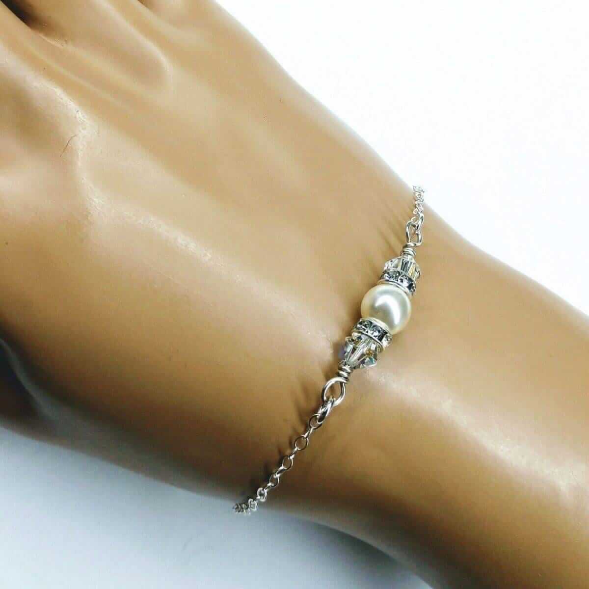 Silver bracelet with a pearl on a mannequin wrist