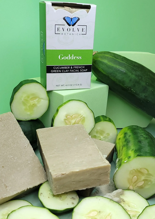 Evolve Botanics Goddess Cucumber & French Green Clay Facial Soap with cucumber slices on a green background