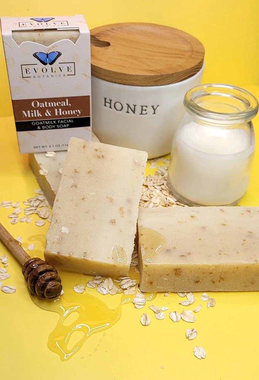 Oatmeal, Milk & Honey soap with packaging and ingredients on a yellow background