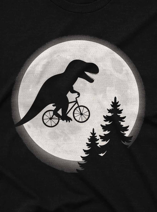 T-shirt with a dinosaur riding a bicycle silhouette against a moonlit sky design.