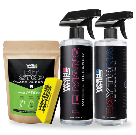 Collection of Wash & Whips car care products including a glass cleaner, wheel cleaner, and tire cleaner with a yellow sponge on a white background.