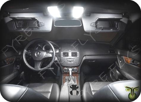 Car interior with illuminated ceiling lights