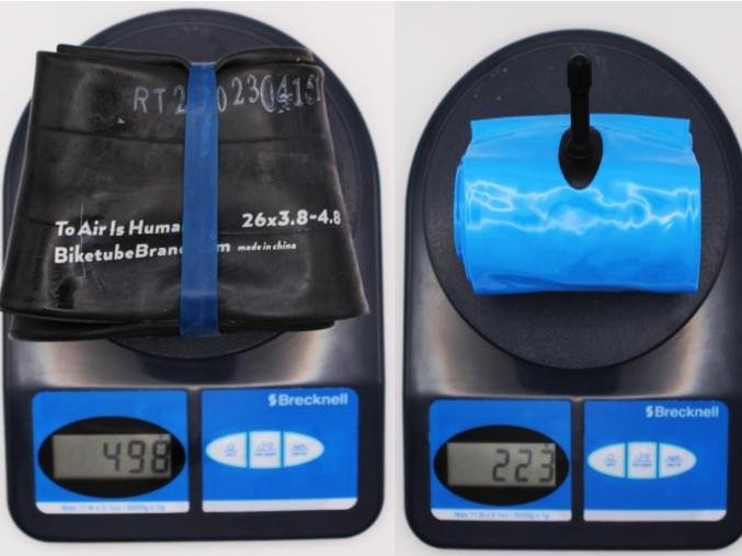 Two bike inner tubes on digital scales with visible branding and measurements.