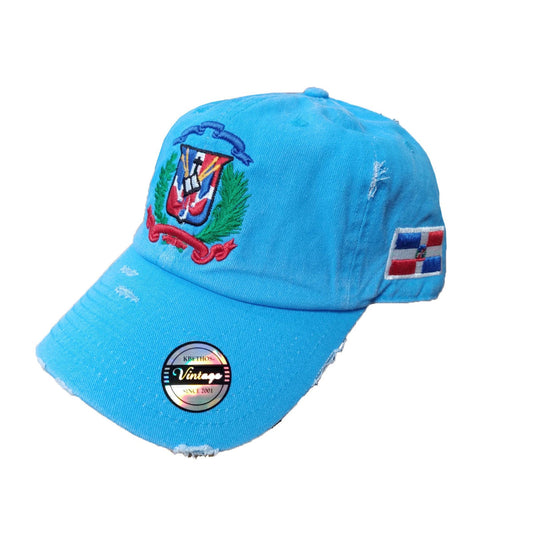 Blue cap with embroidered designs on a white background