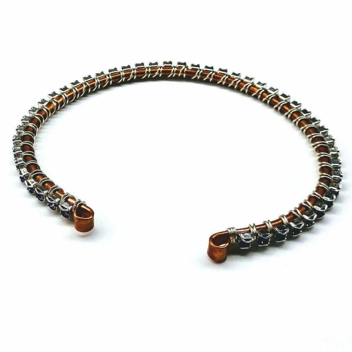 Necklace with brown and silver beads on a white background