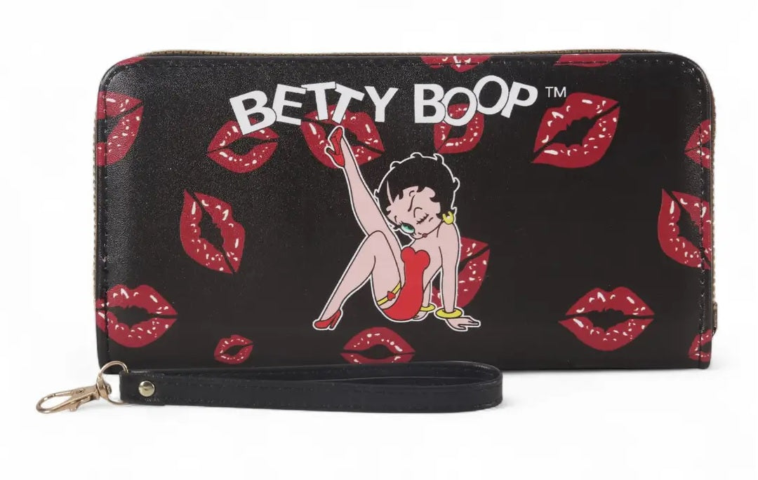 A black zip-around wallet featuring a red and white Betty Boop print, complete with a wrist strap and metal clasp, set against a plain white background.